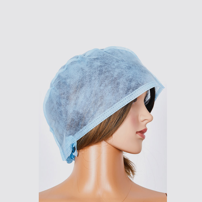 Non woven surgical cap with ties